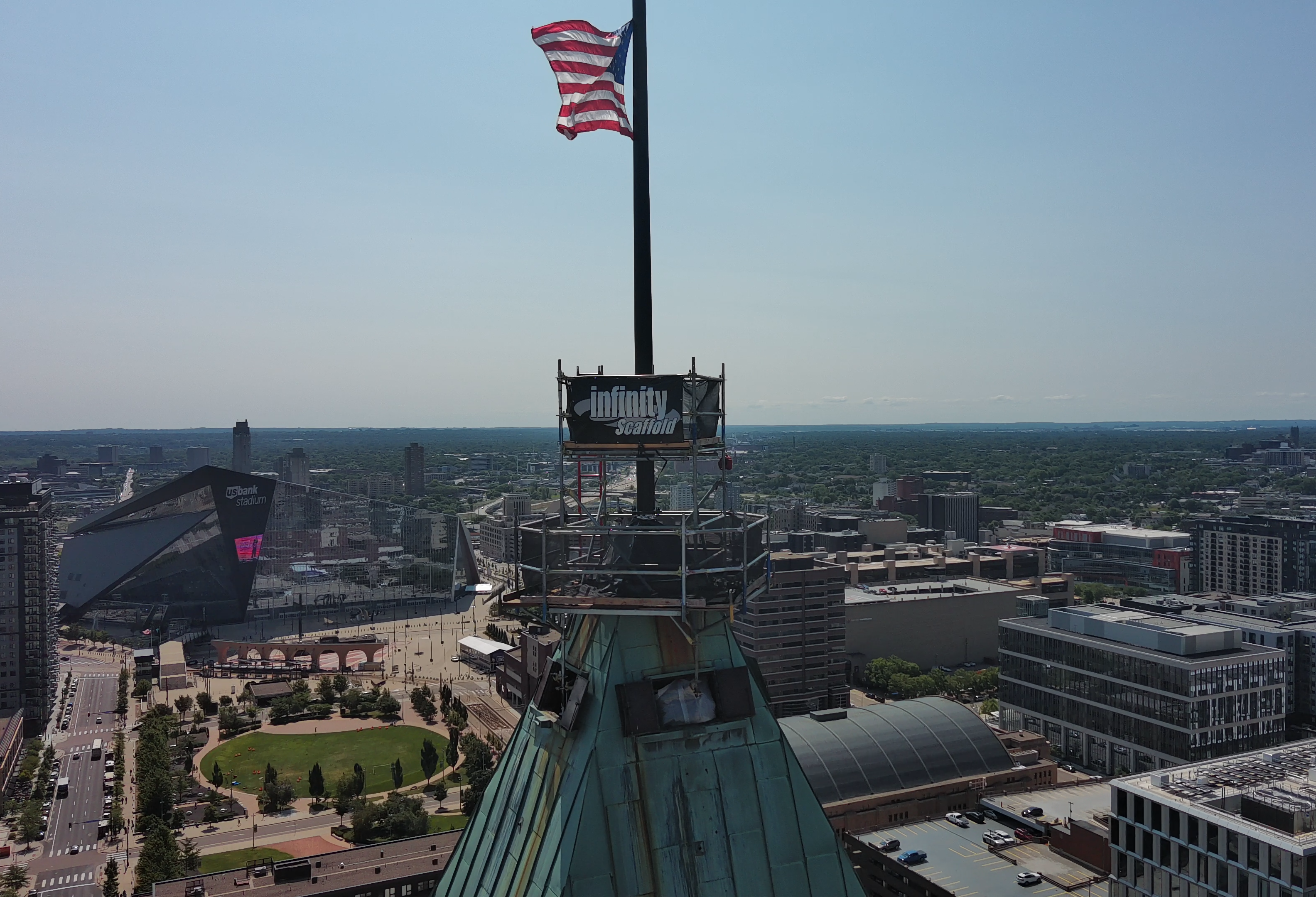 Construction workers on scaffolding at historic landmark