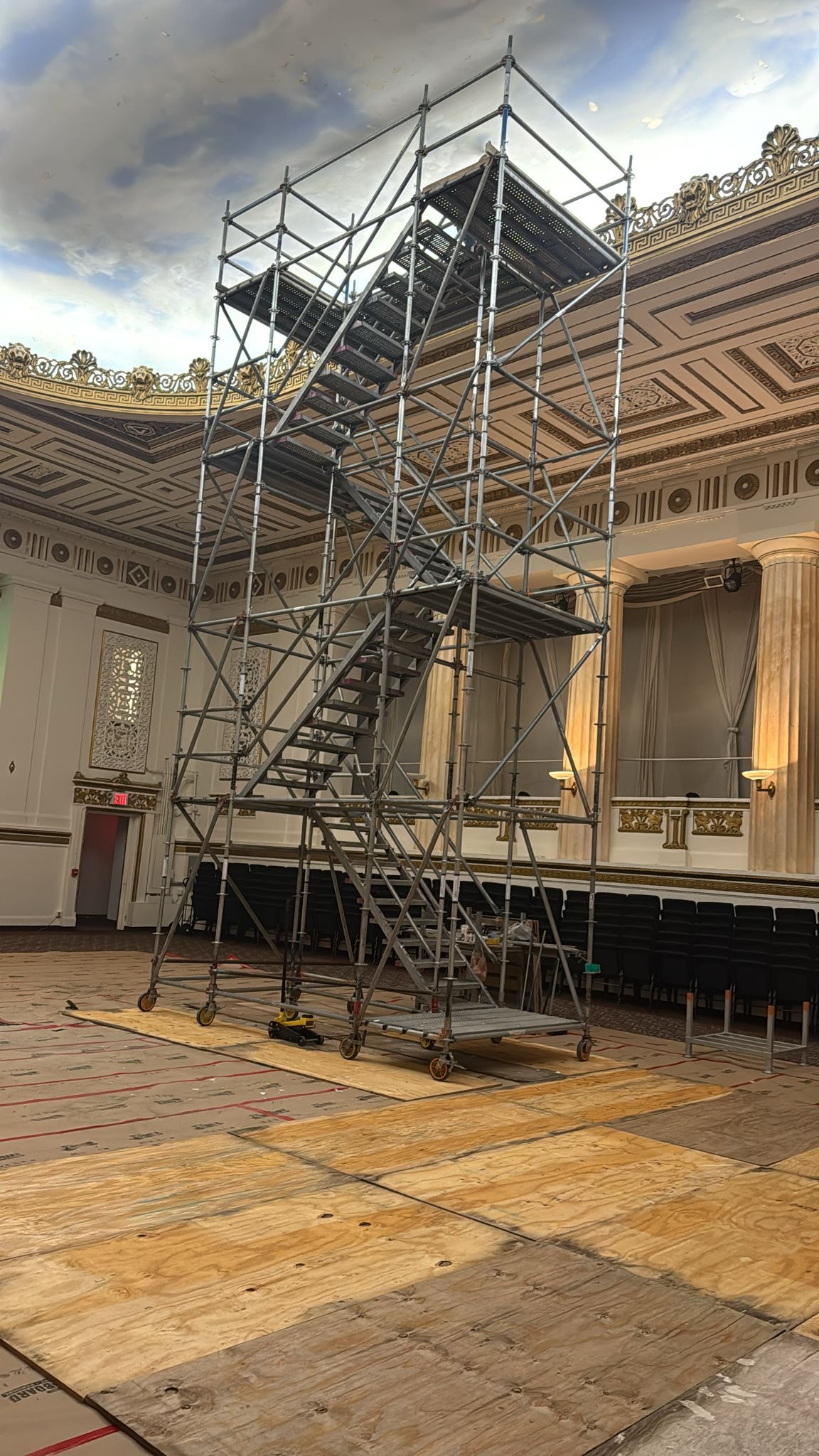 A ramp attached to a stair tower to give access over the roof parapet wall