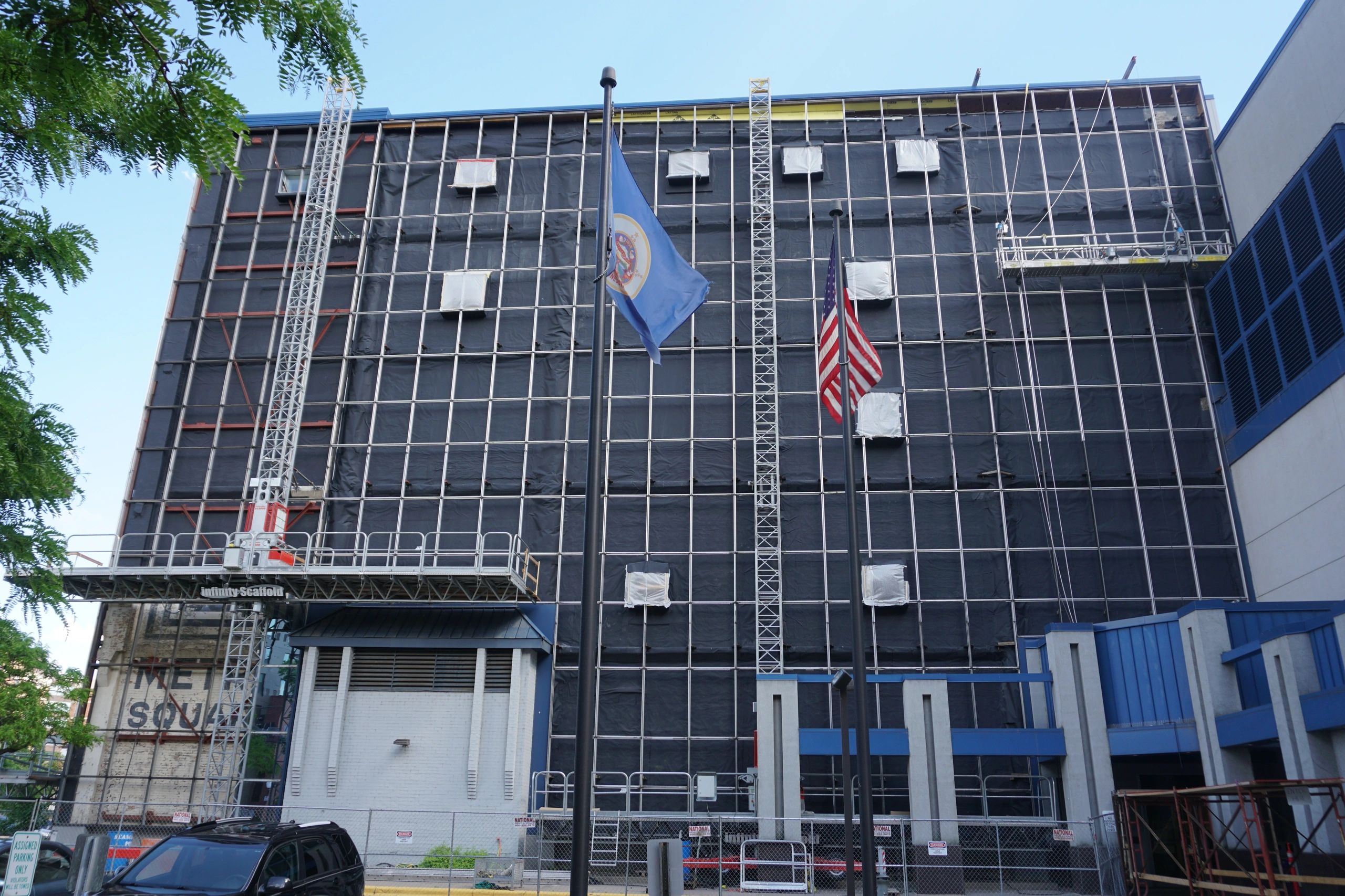 Mast climber scaffold and swing stage scaffold providing exterior access for commercial construction