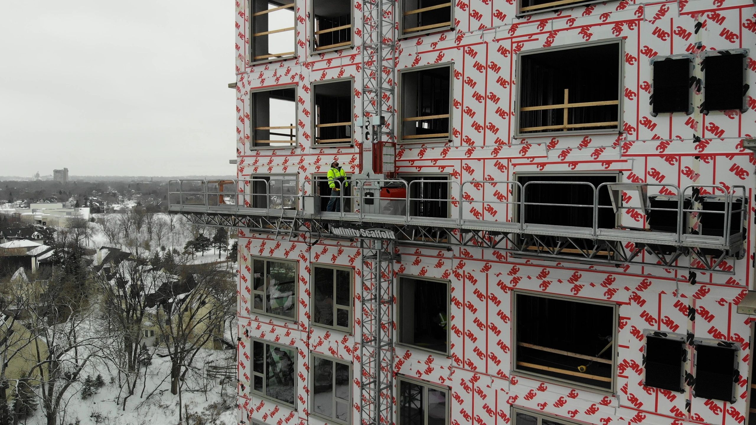 Mast Climber on the exterior of a new building during the construction phase