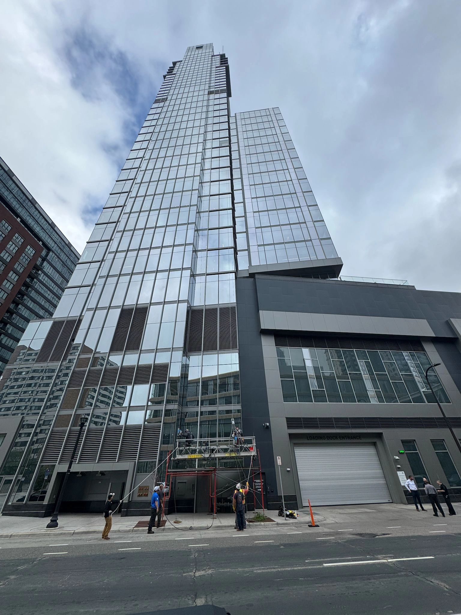 Swing stage providing least intrusive access on a tall building